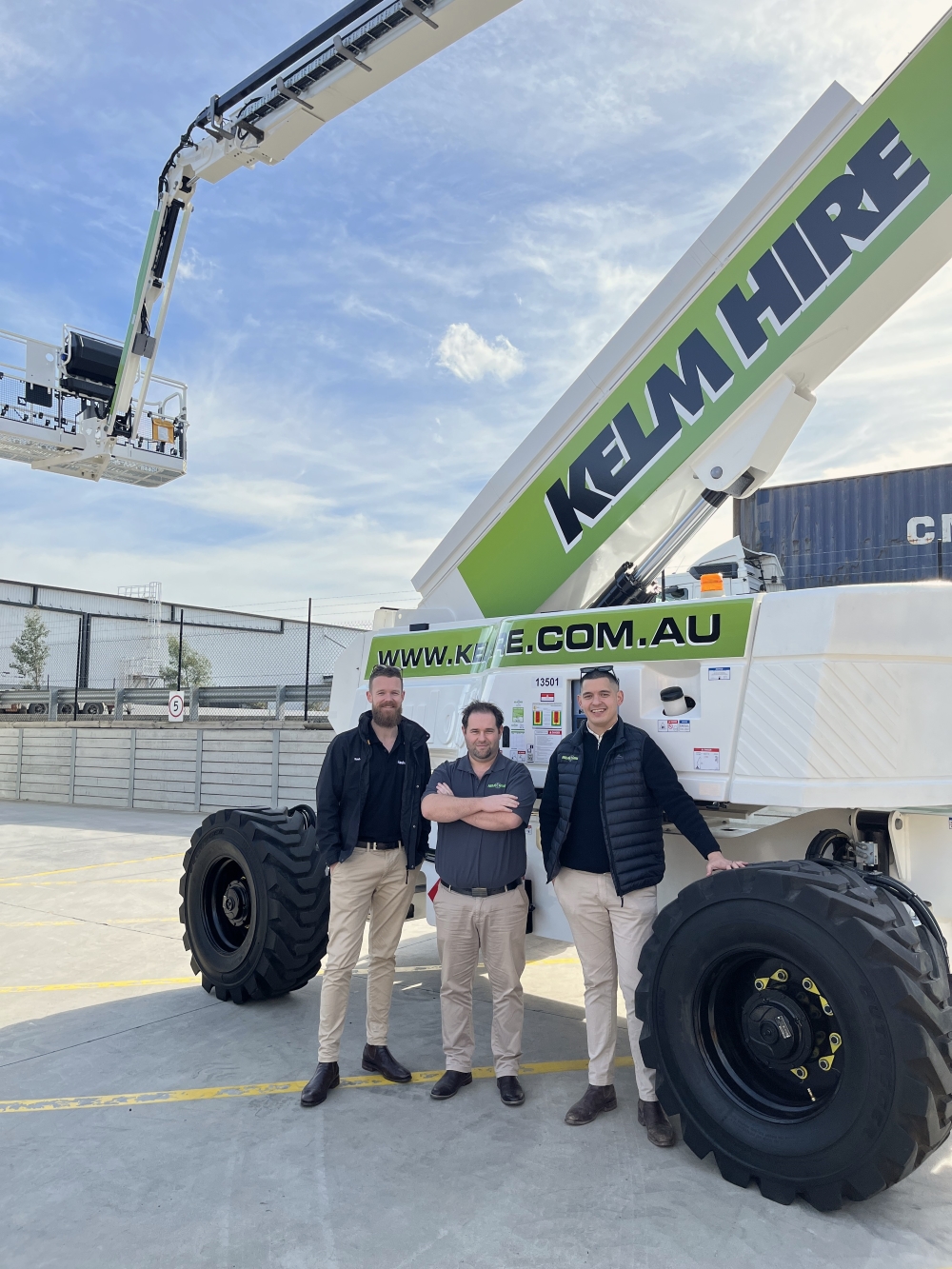 people standing in front of boom lift